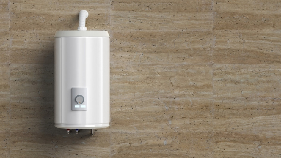 Que-es-un-boiler-o-calentador-de-agua Calentador de agua blanco en un pared de madera.